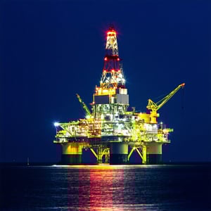 Emergency Power - Nighttime view of an offshore platform with emergency lights glowing highlighting isolated and remote conditions